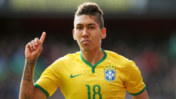 LONDON, ENGLAND - MARCH 29:  Firmino of Brazil celebrates after scoring the opening goal during the international friendly match between Brazil and Chile at the Emirates Stadium on March 29, 2015 in London, England.  (Photo by Paul Gilham/Getty Images)